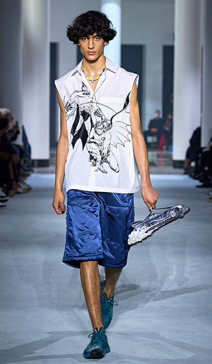 model wering Batman apparel -Consumer Products and DC Comics partnered with the French fashion house Lanvin 